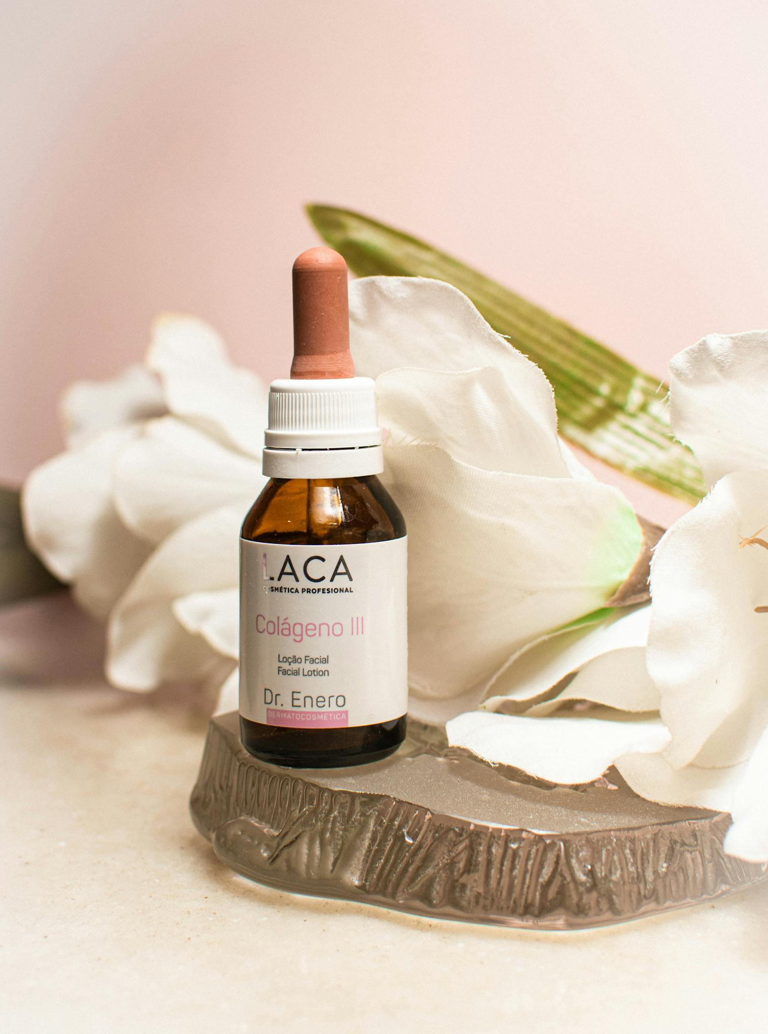 Close-up of collagen facial serum with white petals, a touch of elegance and skincare.